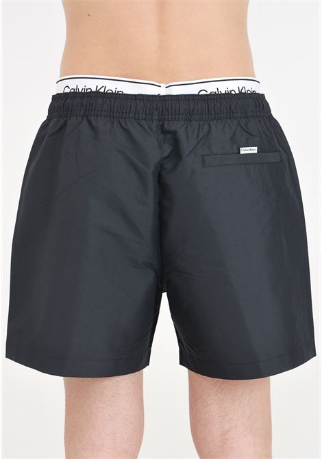 Shorts mare nero da uomo con stampa logo ed elastico in vita logato CALVIN KLEIN | KM0KM00957BEH